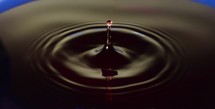 Water Drop Photography, A close up of water spire splashing up out of water.
