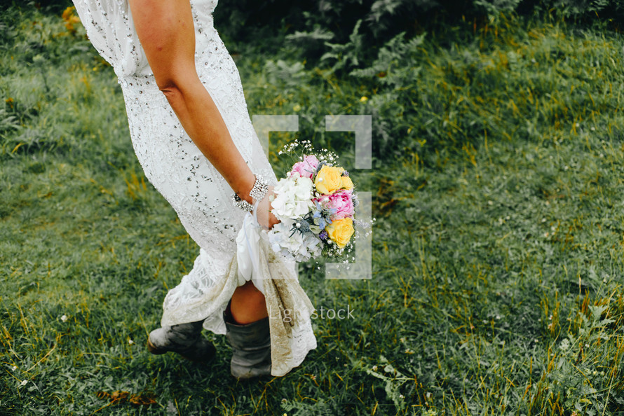 a bride carrying a bouquet 