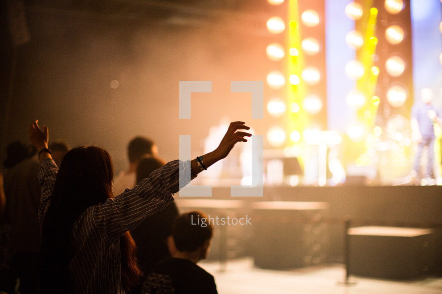 raised hands at a concert 
