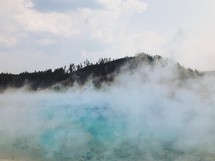 steam over a mountain hot springs 
