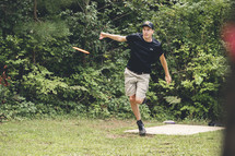 man throwing a frisbee 