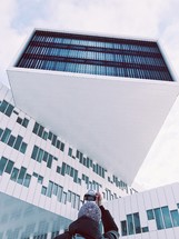 a man taking a picture of a building with his camera 