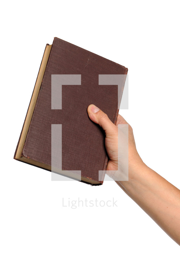 A hand holding a Bible.