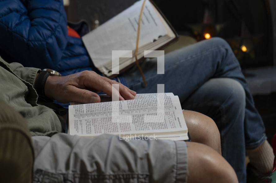 Close up men studying the Bible at a small group meeting