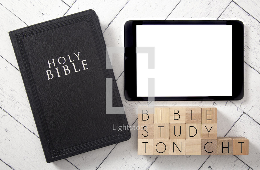 Bible and tablet on a white wood background - Bible study tonight 