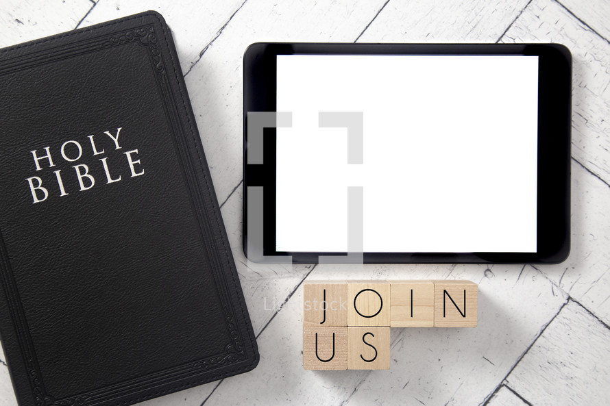 Bible and tablet on a white wood background - join us 