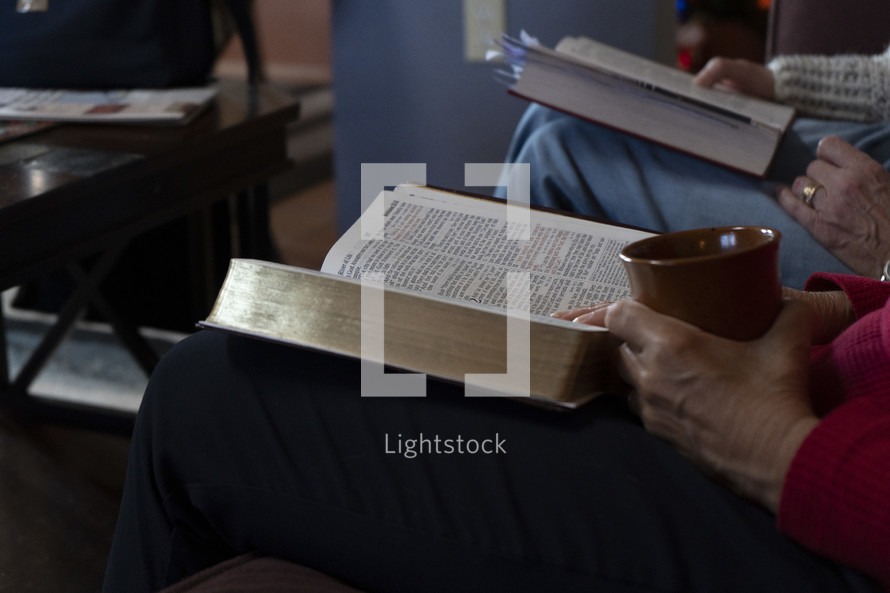 Close up of women studying the Bible at a home group meeting