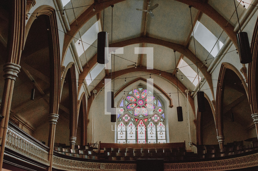 stained glass window and choir loft 