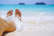 bare feet on Caribbean sand 