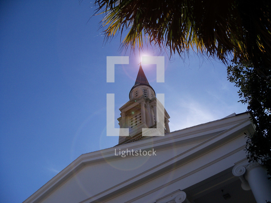 The Beacon of Hope - sun above a church steeple