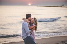 couple kissing on a beach 