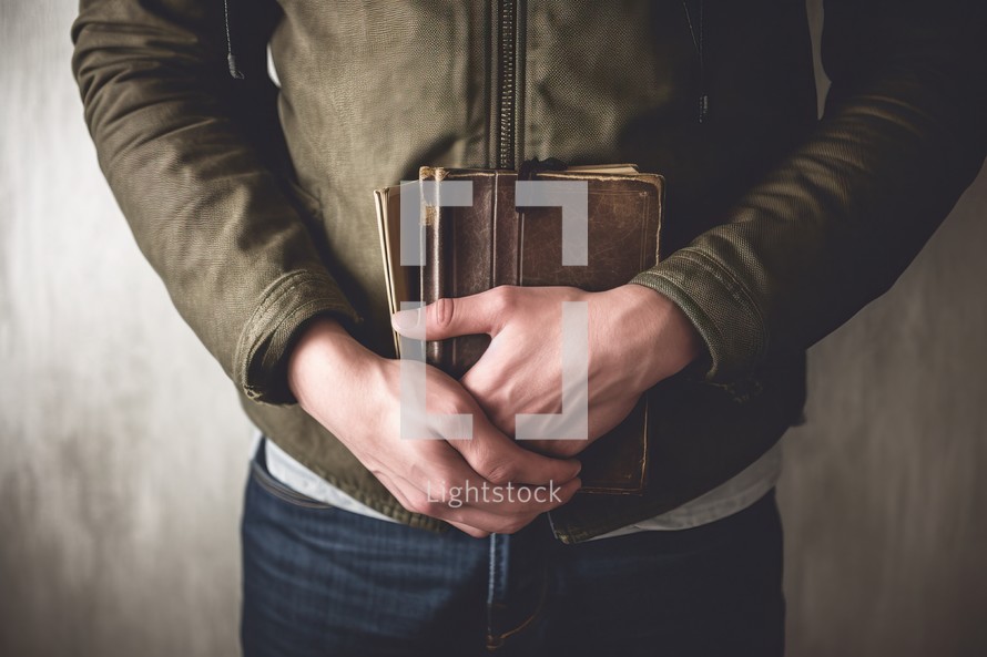 Man Holding Old Bible