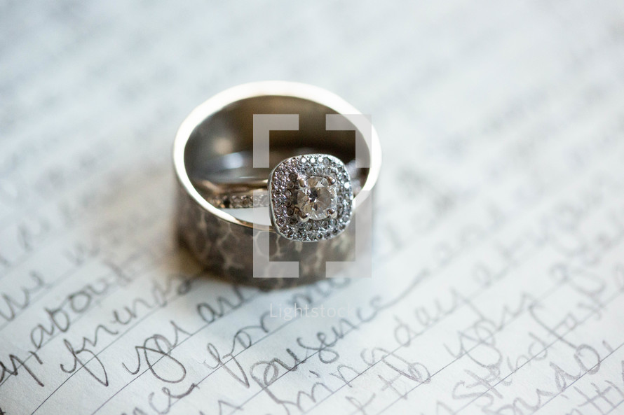 wedding rings on a love note 