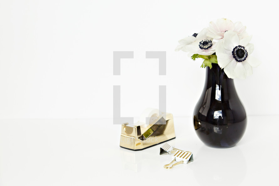 tape dispense, gold, clubs, desk, white, flowers, black centers, white background 