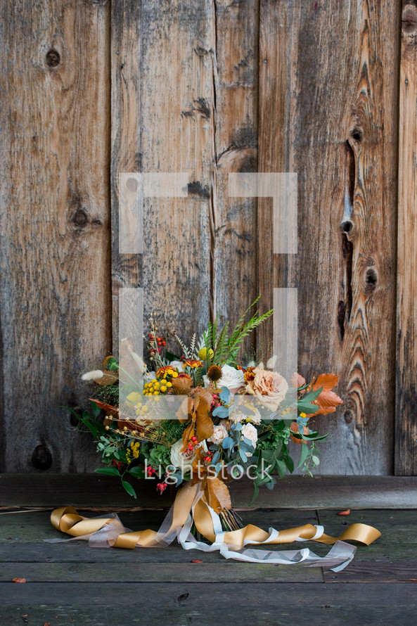 wedding bouquet against a wood background 