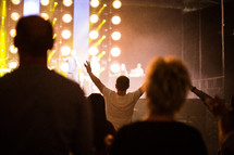 hands raised in worship during a Christian concert 