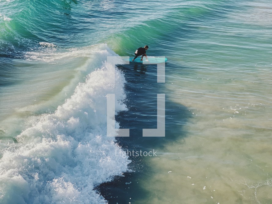 surfer catching a wave