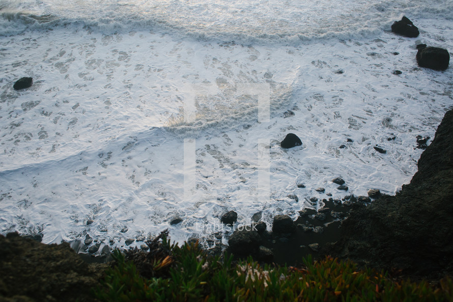sea foam along a shore