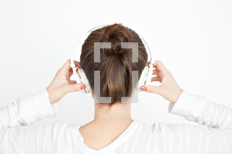 a woman listening to headphones 