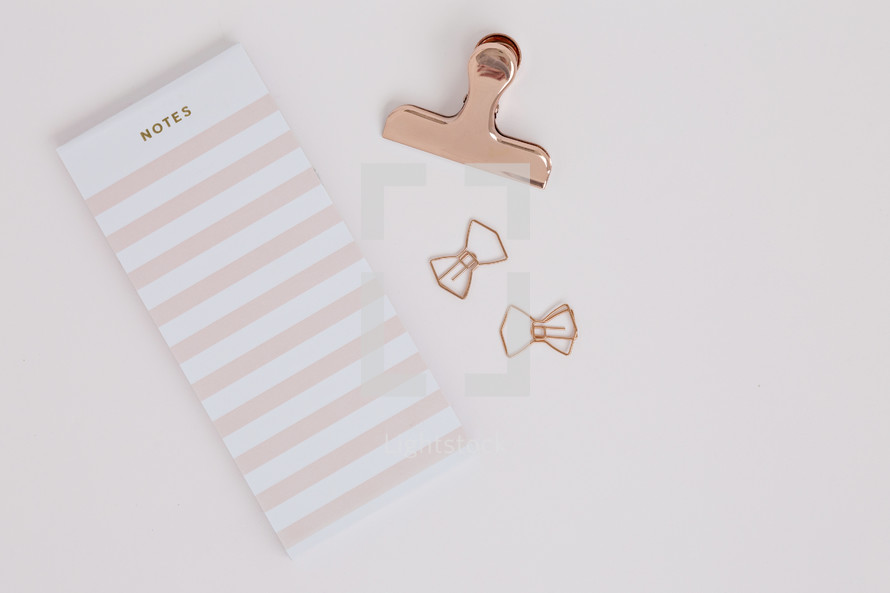 notebook and paper clips 