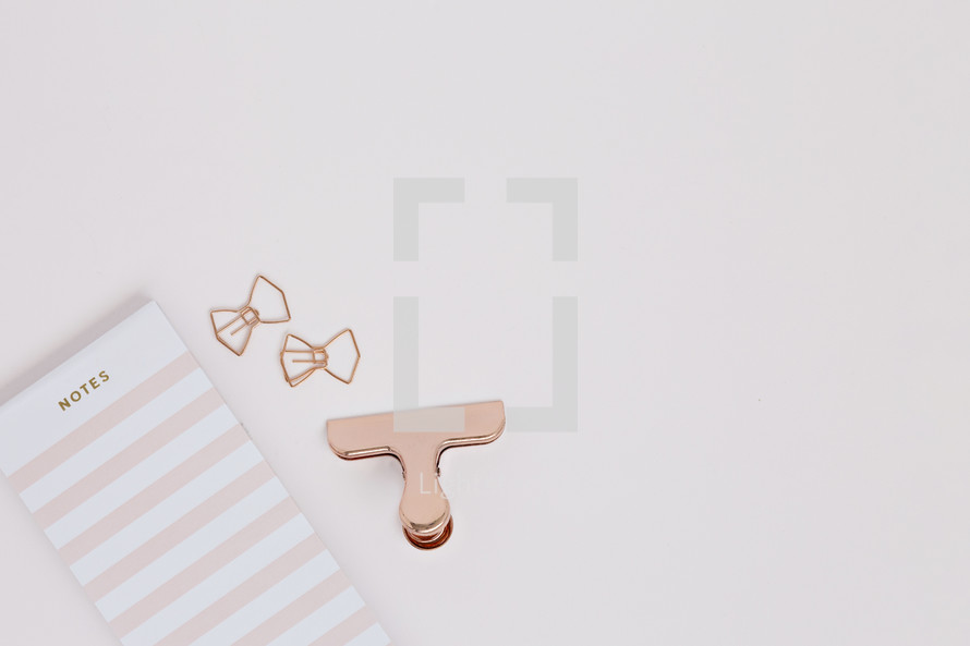 notebook, and clips in rose gold 