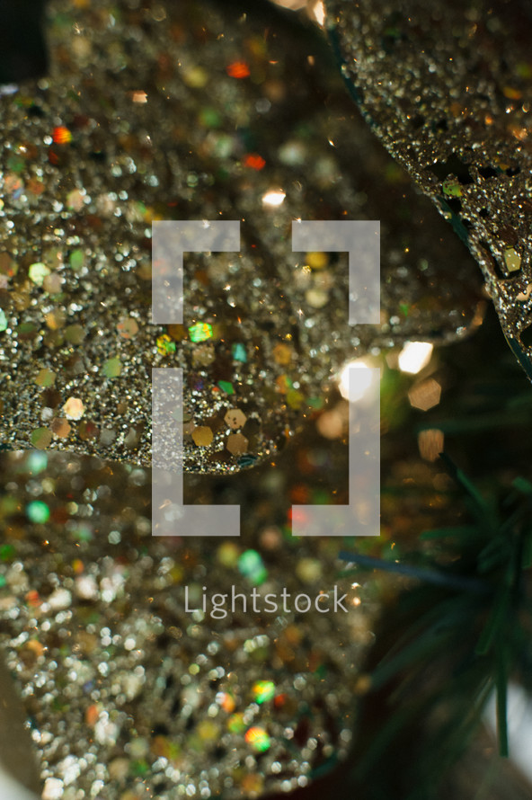 gold glitter ribbon on a Christmas tree 