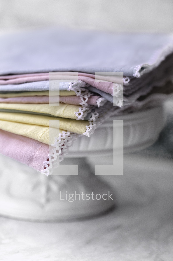 Colorful pastel napkins on a cake plate