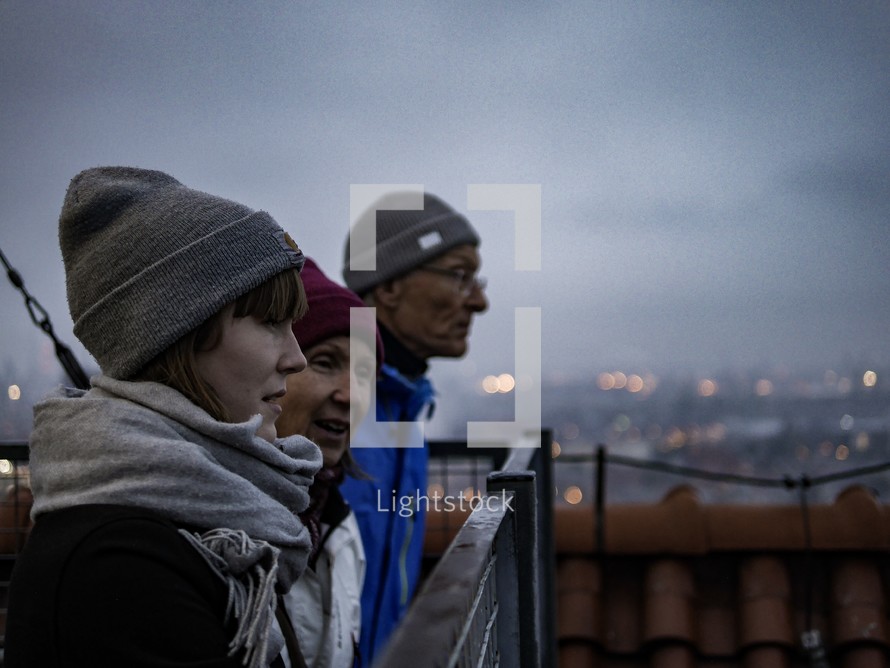 People looking out at a view over a foggy Gdansk, Poland 