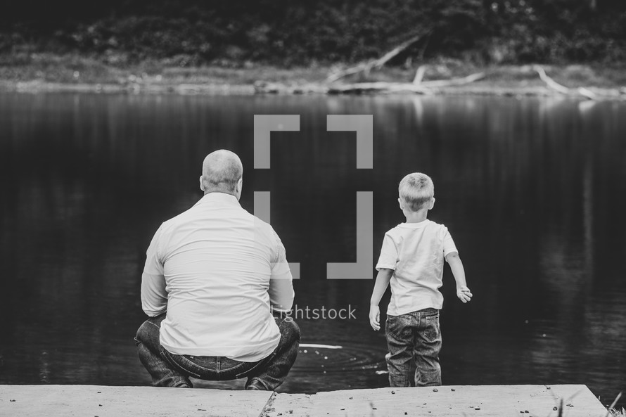 father and son fishing on a dock 