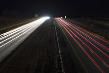 blurred headlights and taillights on a divided highway 