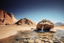 Water flowing from a rock in the desert, Moses in Exodus