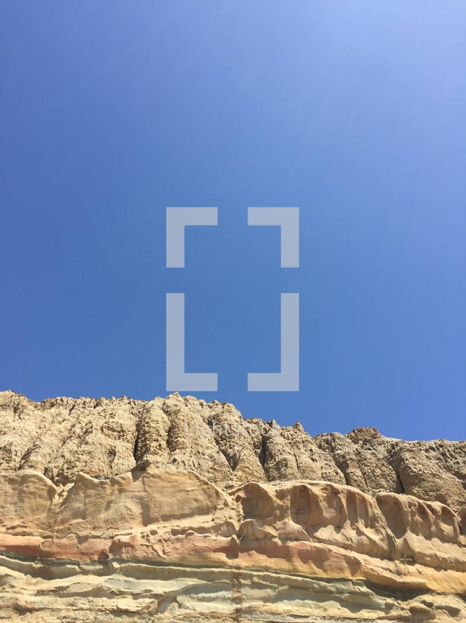 blue sky over cliffs 