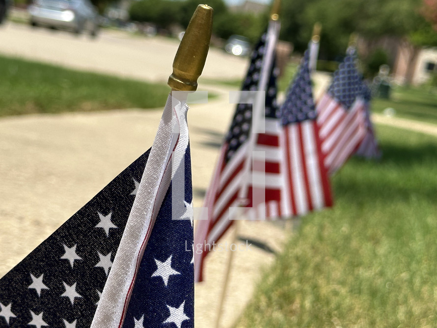 American flags along a sidewalk