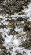 Rocks in the river water flowing down