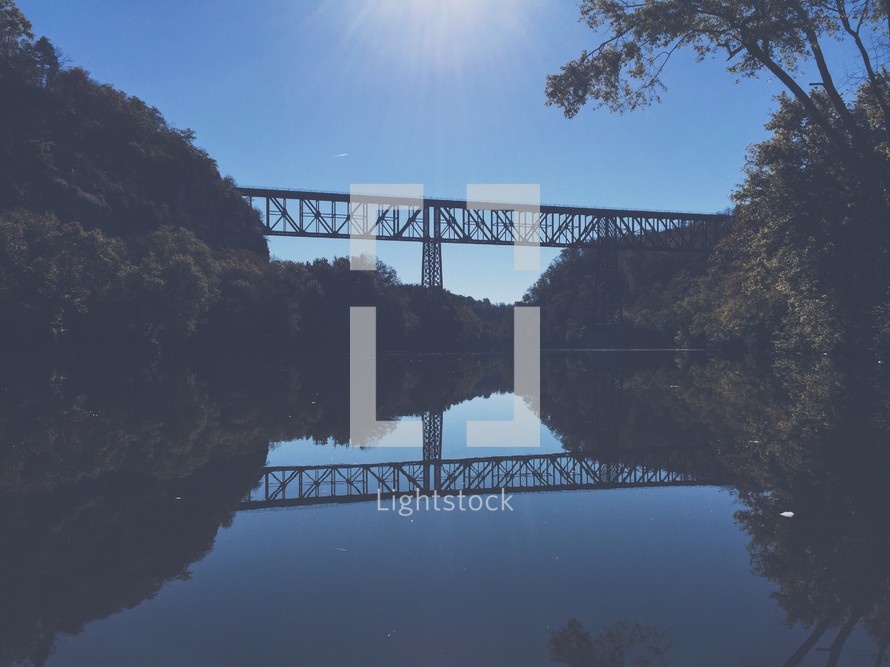 tall highway bridge over a river 