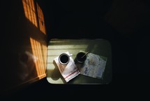 coffee and maps on a table 