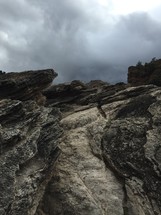 gray clouds and rock cliff 