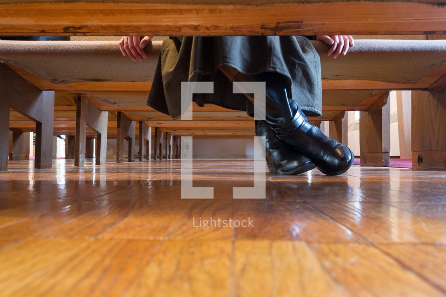 boots under church pews 