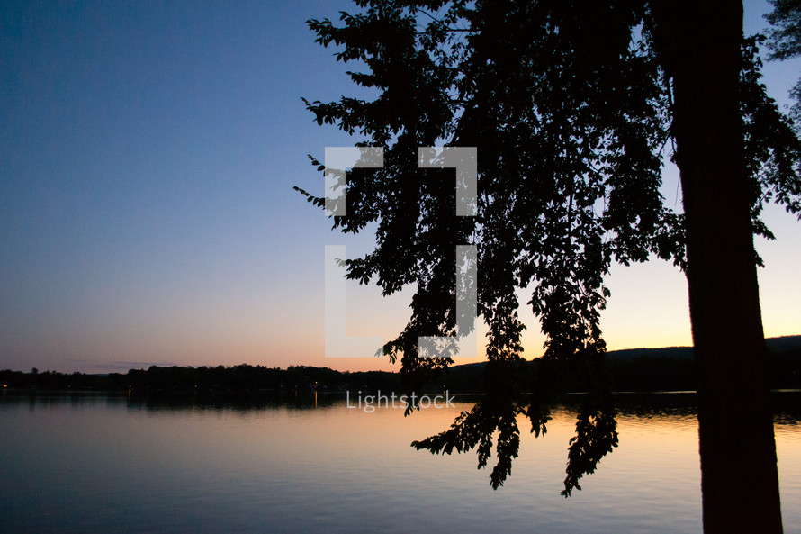 calm lake water at dusk 