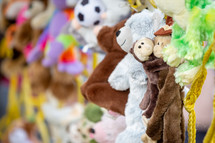 Stuffed animals hanging on display