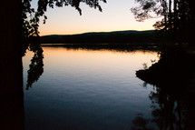 calm lake water at dusk 