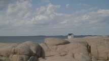 small house on the coast in sweden on a rock