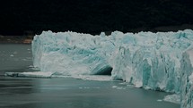 Hole On The Massive Icebergs On Perito Moreno Glacier In The Argentine Patagonia. Wide Shot	