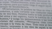 Close up of a page in a Spanish translation Bible.