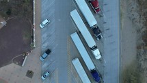 Aerial of semi trucks parked at a rest area