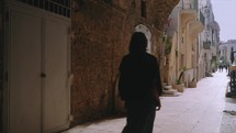 Girl walking in the streets of Italy