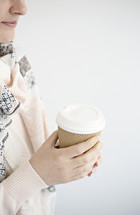 a woman holding a coffee cup 