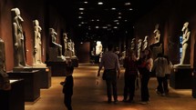 TURIN, ITALY - CIRCA DECEMBER 2022: Tourists visiting the Museo Egizio translation Egyptian Museum - EDITORIAL USE ONLY
