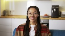 Portrait beautiful african american woman smiling looking happy feeling confident, wearing earphones.