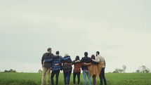 group standing together in a field 